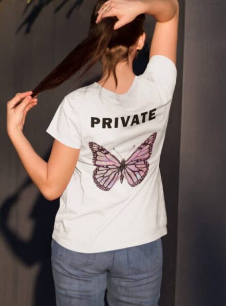 t-shirt-mockup-featuring-a-girl-from-the-back-in-a-courtyard-a9173